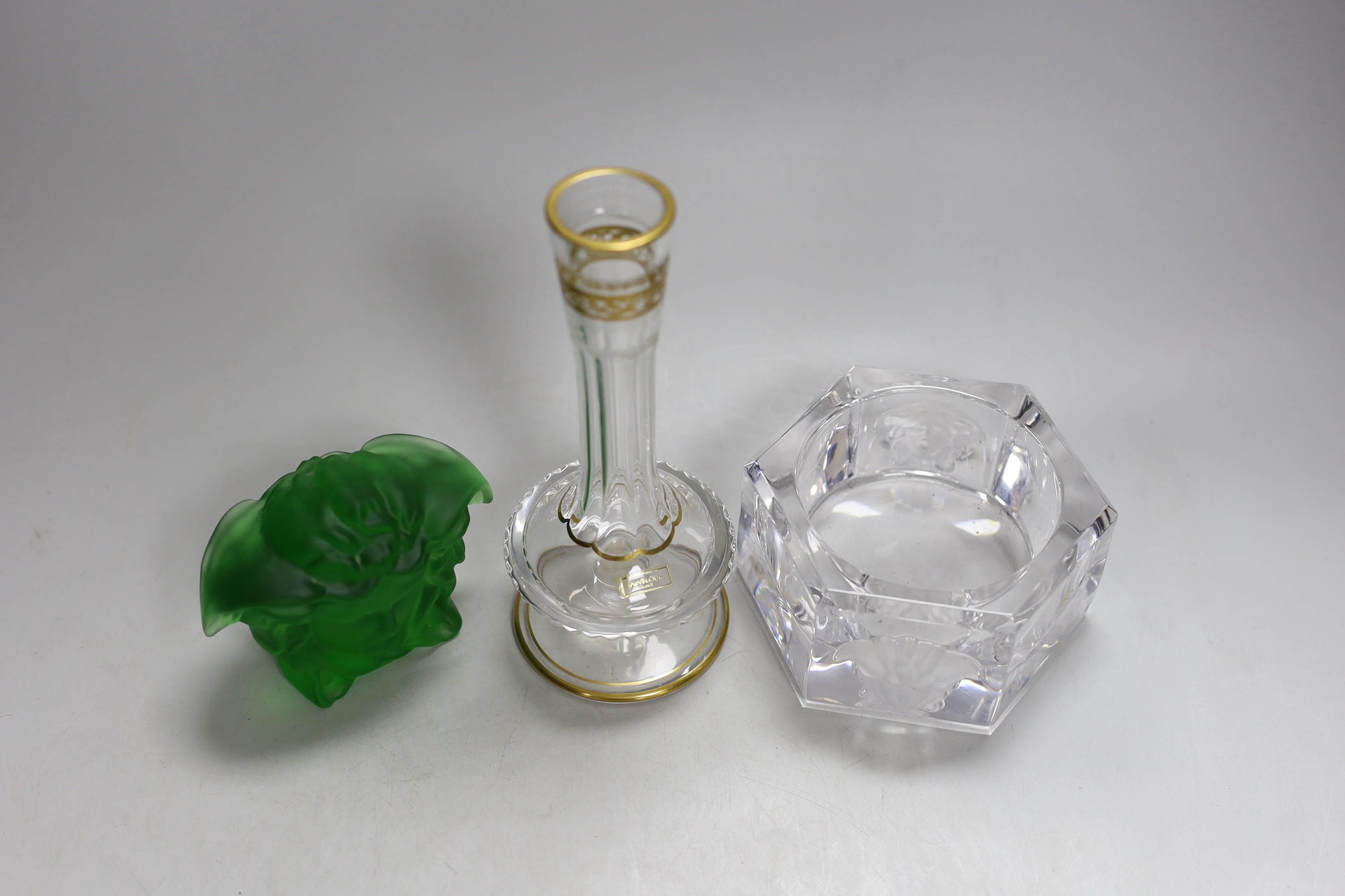 A Versace pressed green glass Medusa paperweight, a Versace ashtray and Asprey Saint Louis scent bottle